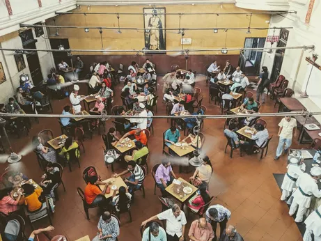 Guests eating at food hall tables